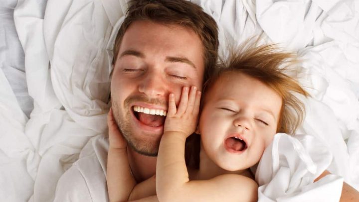 Father and daughter laughing and bonding to represent good parenting